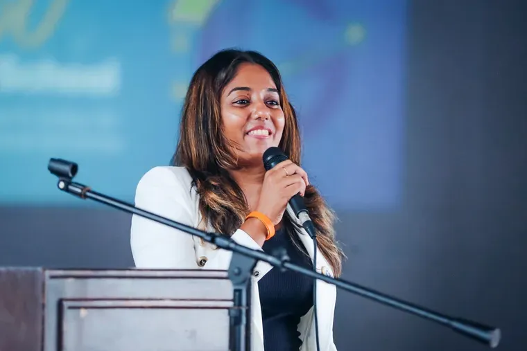A speaker at the podium, addressing the hall.