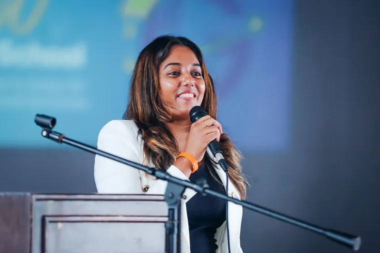 A speaker at the podium, addressing the hall.